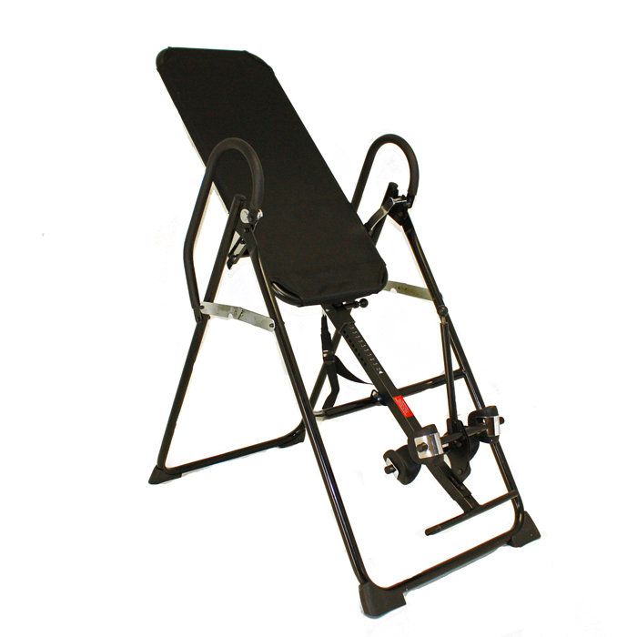 How can using an inversion table help with lower back pain?